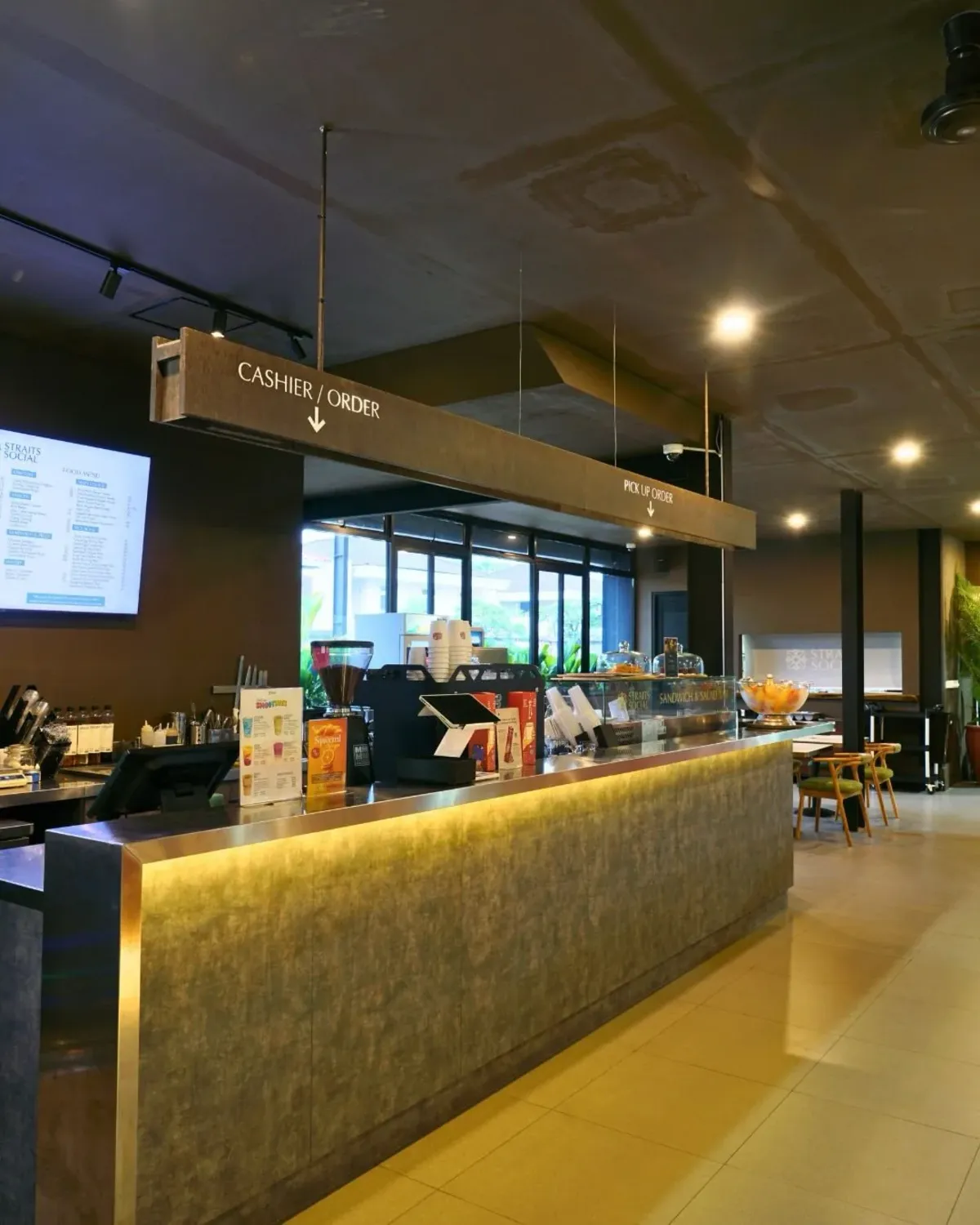 Straits Social counter with brass ordering signs